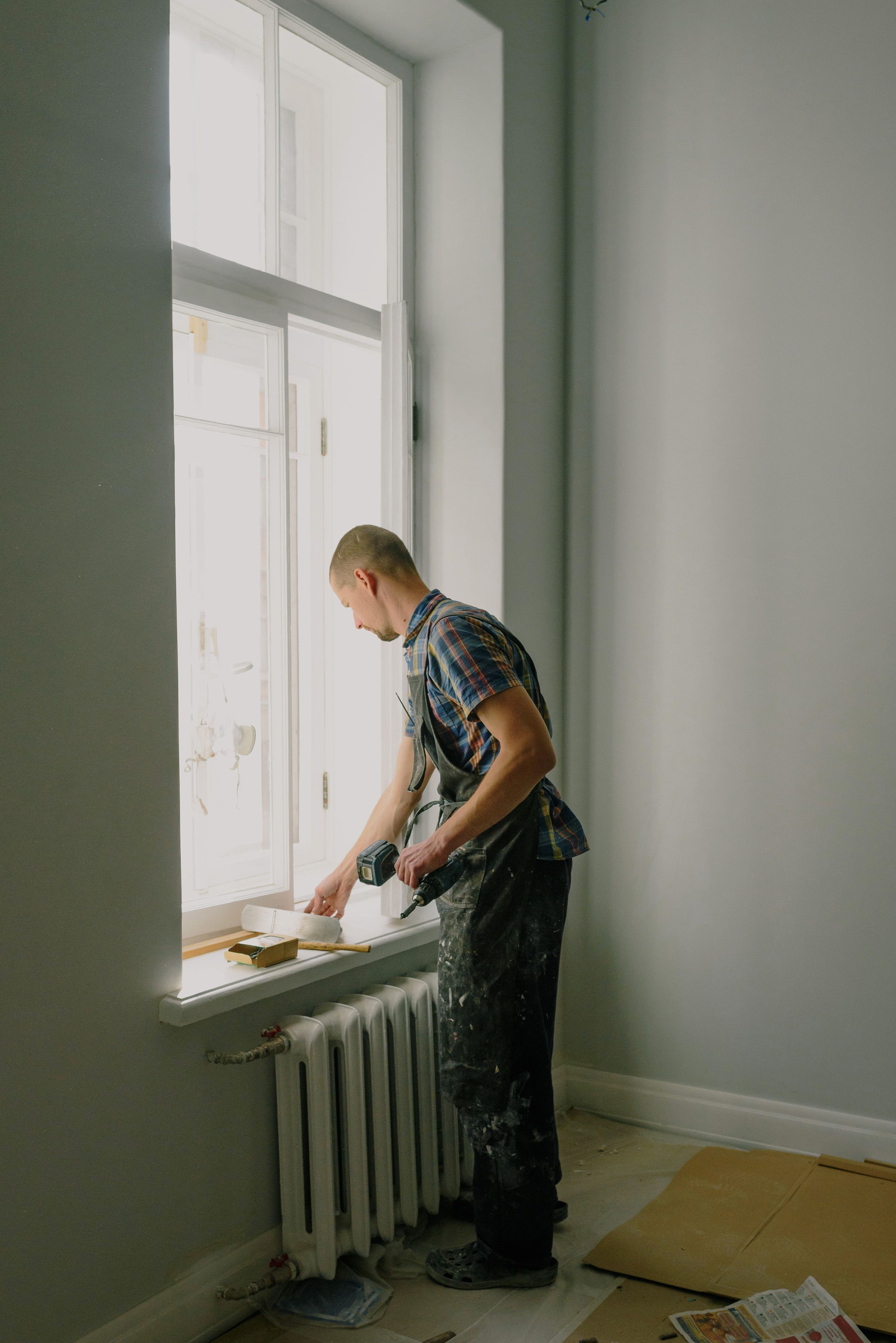 Painter finishing interior surfaces